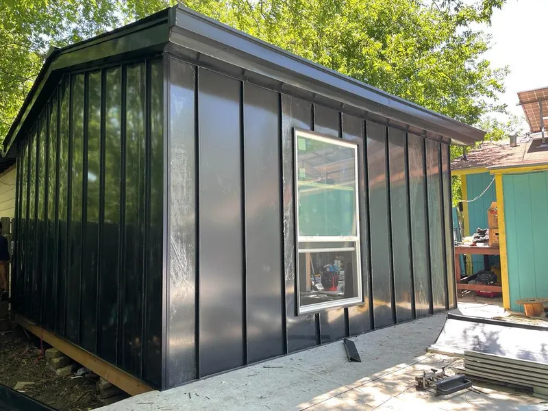 Black standing seam metal wall panels for Metal Roof Installation in Menominee