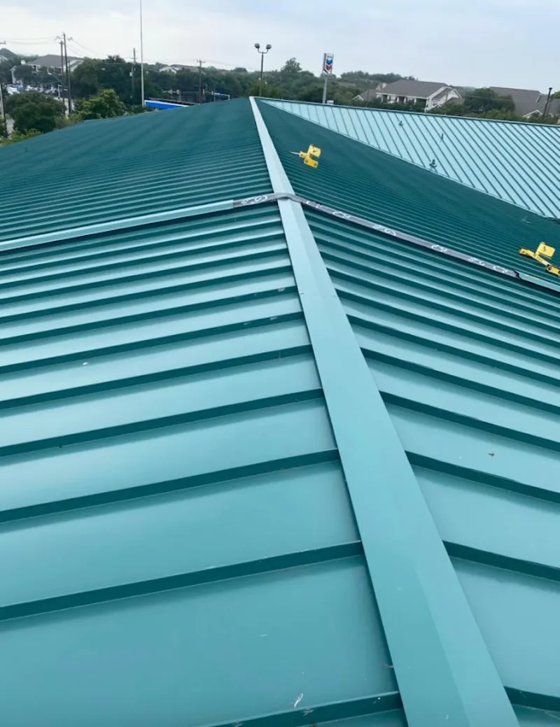 Green commercial metal roof ridge and valley for Metal Roof Repair in Menominee